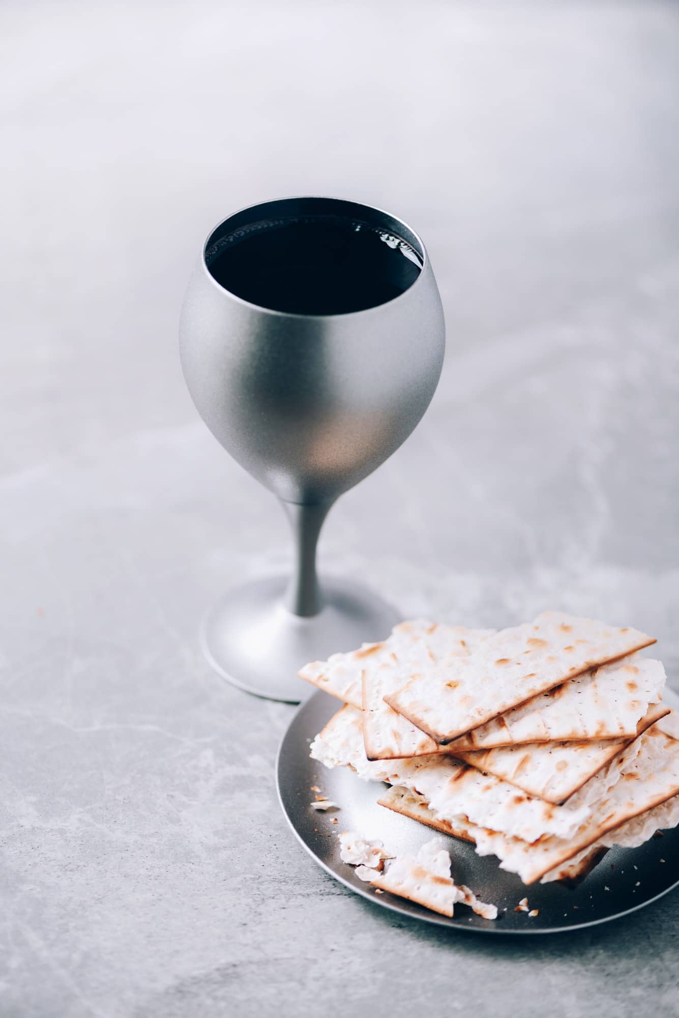 Jesish kiddush wine cup for passover with matzot, matzo bread. Pesah holiday. Banner with copy space